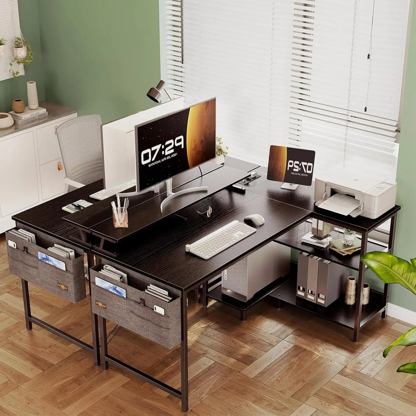 Modern gaming desk setup with monitor, printer, and storage, featuring sleek design and natural lighting.
