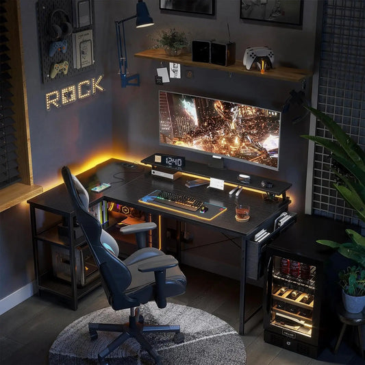 Stylish gaming desk setup with a monitor, keyboard, chair, and decorative LED lights in a modern home office.