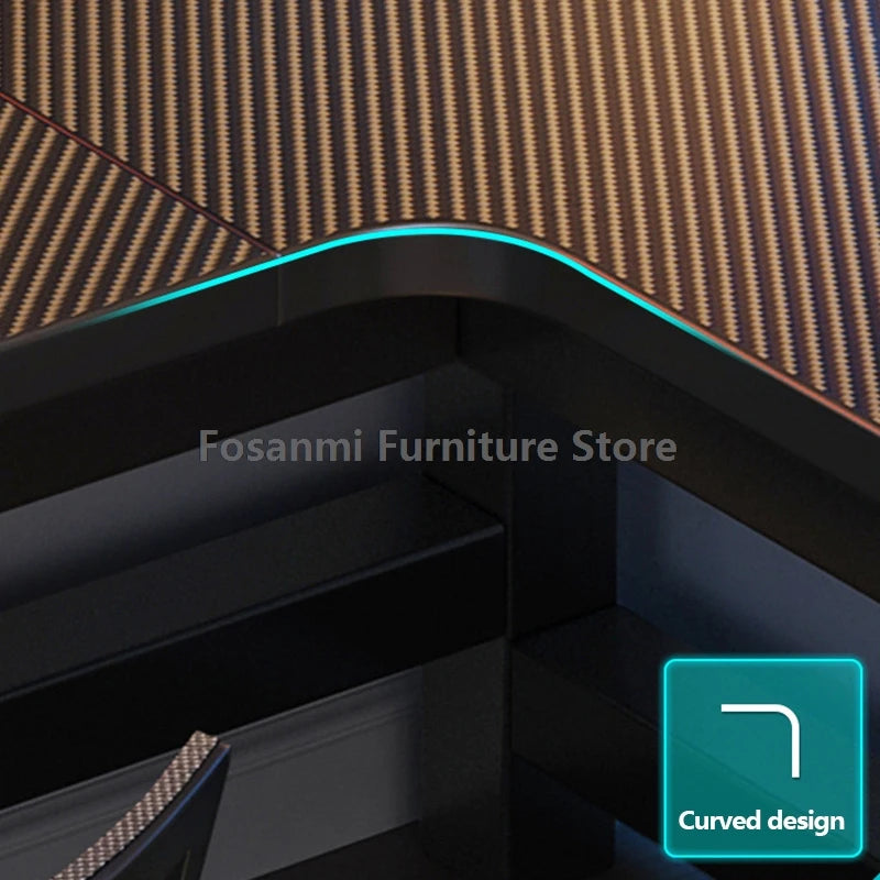 Close-up view of L-shaped gaming desk showcasing the curved design and modern carbon fiber texture.
